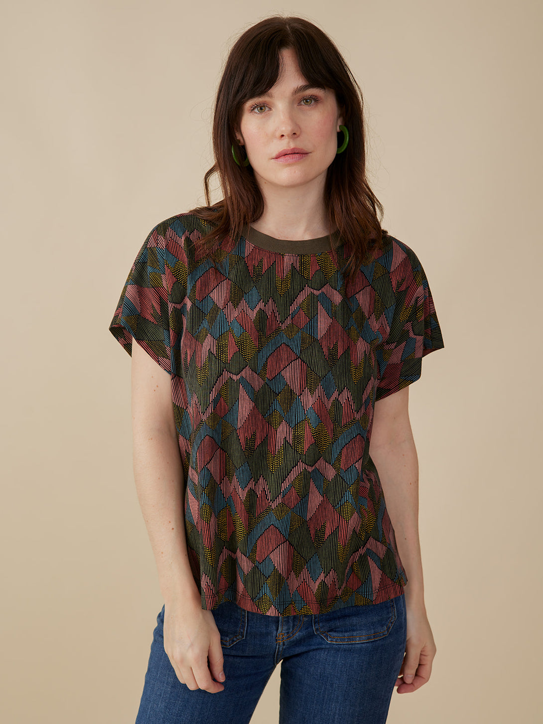 Organic cotton round neck tee top in muted colors abstract jewel print on model - Mata Traders 