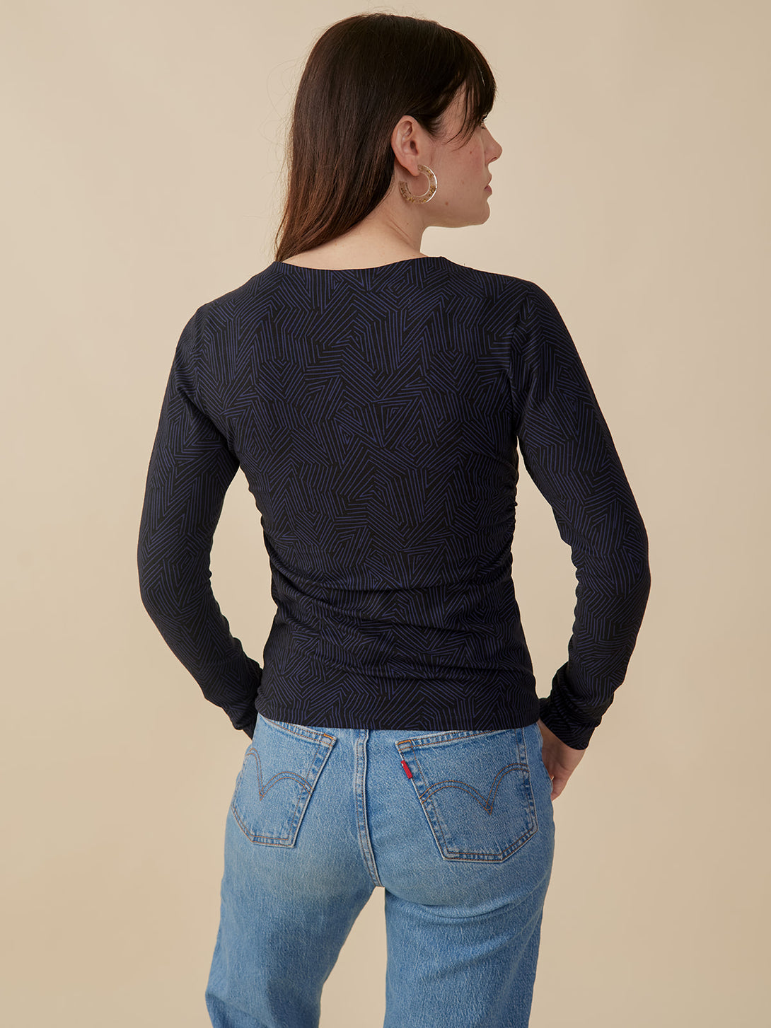 Back view model wearing black and navy tree rings print jersey cotton top long sleeve - Mata Traders Fair Trade Brand