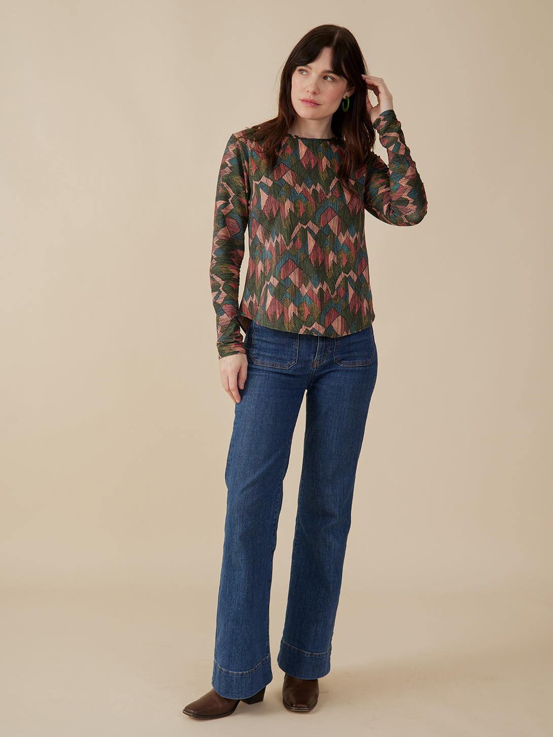 Organic cotton fall stretch top in muted colors abstract jewel print styled with jeans on model- Mata Traders 
