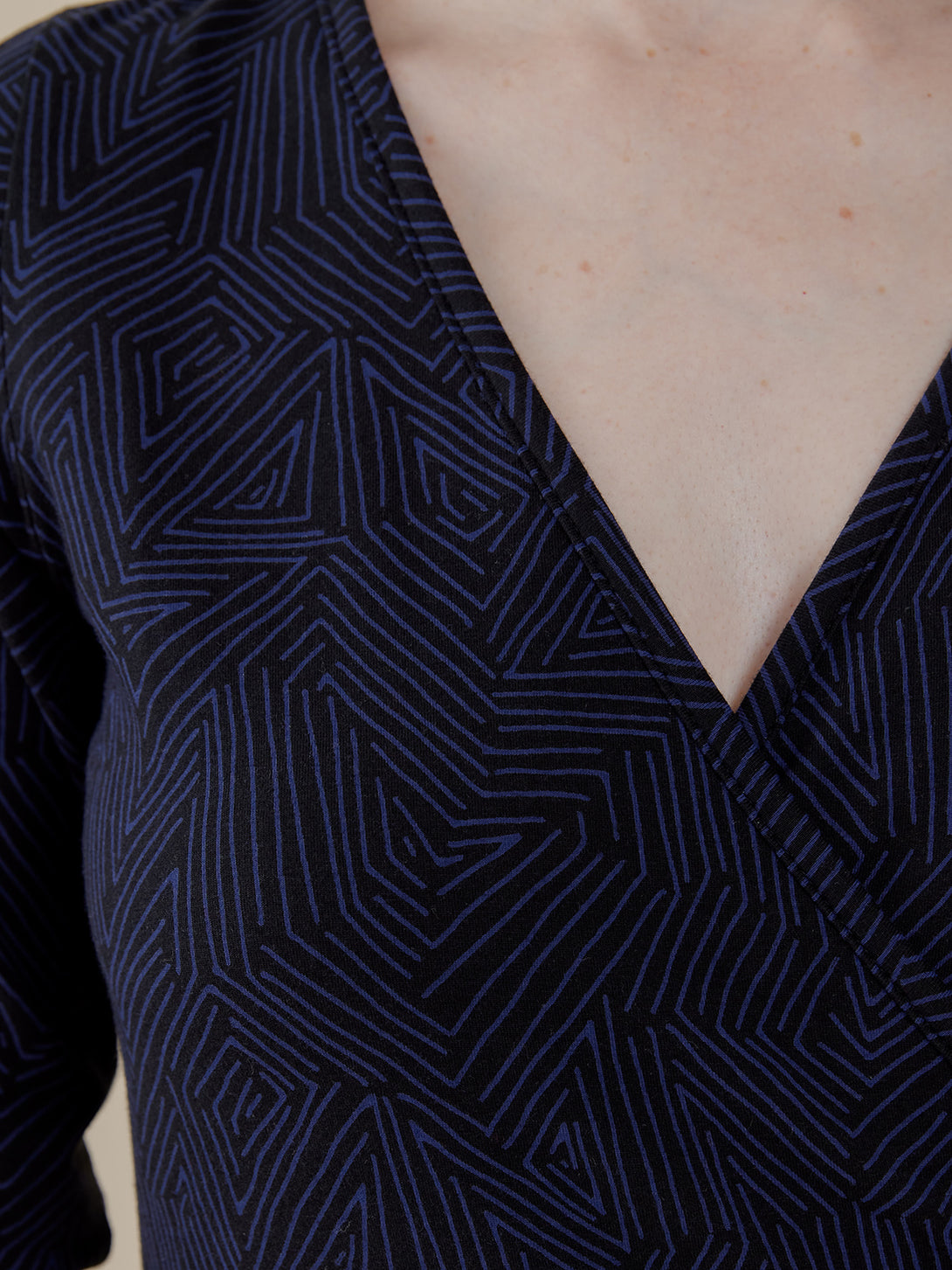 close-up detail navy blue print abstract organic jersey v-neck wrap dress - Mata Traders