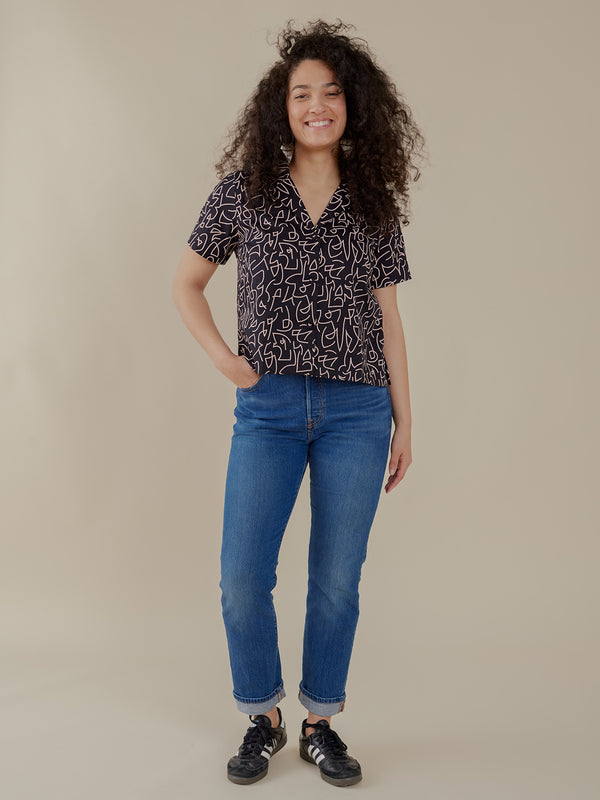 Fall Black and White Top with Button Front and V Neck Collar  styled with Jeans on Model - Mata Traders Ethical Fashion Brand 