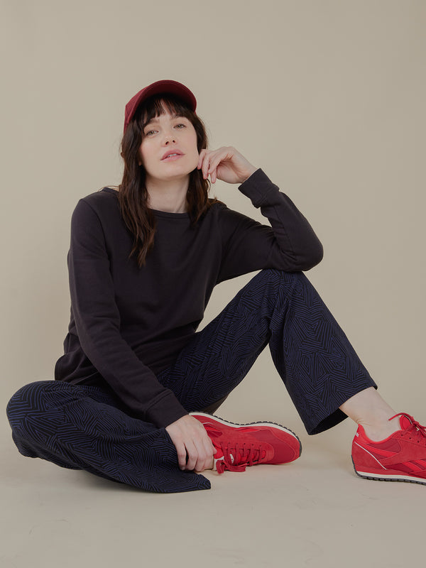 Navy fold over organic cotton women's casual pants with red sneakers- Mata Traders Brand