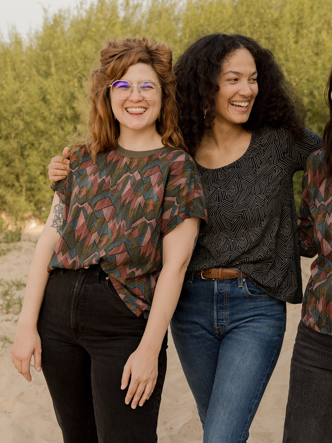 Organic cotton fall stretch top in muted colors abstract jewel print on model at the beach - Mata Traders 