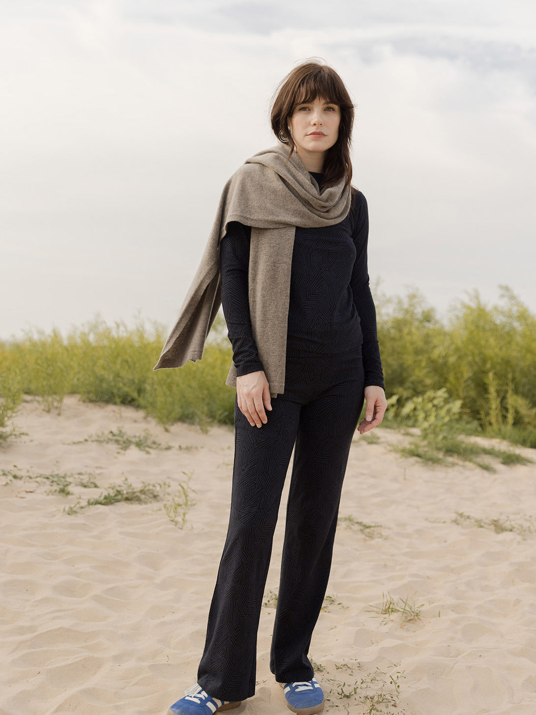 Navy fold over organic cotton women's casual pants  with matching top and tan oversized cashmere scarf on model- Mata Traders
