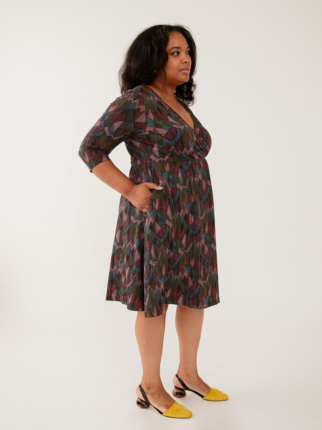 Plus size organic cotton jersey dress 3/4 sleeves on model with pockets - Mata Traders Fair Trade Fashion